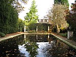 Christ's College bathing pool and summerhouse, including the busts of Cudworth, Milton and Saunderson and stone vase in Memory of Joseph Mede