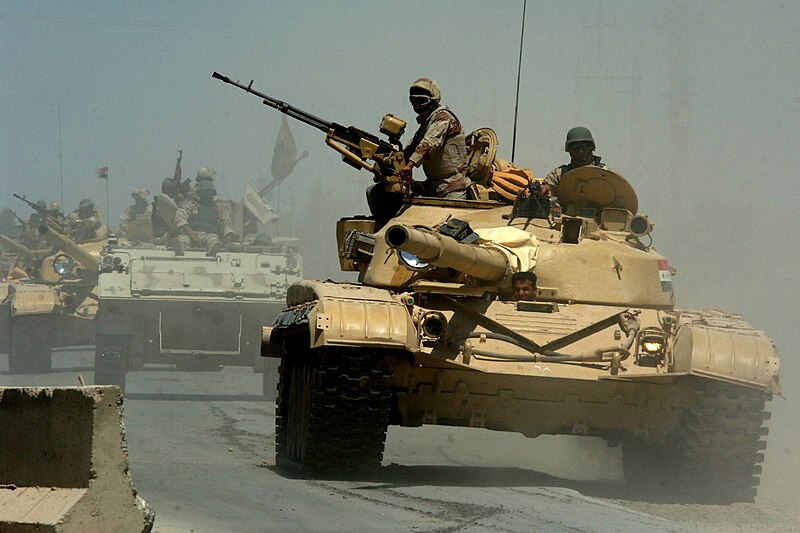 الموسوعة الأكبر لصور و فيديوهات  الجيش العراقي - صفحة 18 800px-Iraqi_T-72_tanks_and_an_M113_APC_from_the_Iraqi_Army_9th_Mechanized_Division_pass_through_a_highway_checkpoint_in_Mushahada,_Iraq