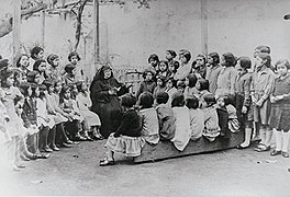 A Marian nun talking to people