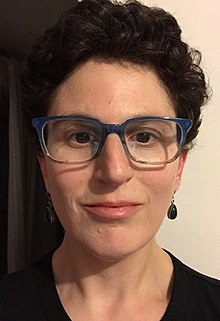 close up head shot of author sarah weinman in glasses