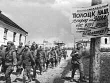 Soviet soldiers in Polotsk, 4 July 1944 Soviet soldiers in Polozk (Belarus), passing by propaganda poster celebrating the reconquest of the city and urging the liberation of the Baltic from Nazi German occupation. July 4, 1944.jpg