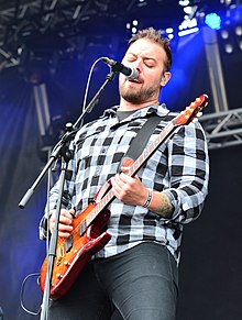 Blay performing with Wovenwar in 2014