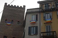 "Pace da tutti i balconi": peace flags hanging from windows in Milan, Italy (March 2003) as over 1,000,000 were hung against the Iraq War Bandiere della pace a Milano 2003.jpg