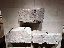 An image of symbols etched on three block of stones. alt= Phoenician writing from right to left. First line reads: Mēm Lāmedh Kaph Bēth Dāleth ʼAyin Šin Tāw Rēš Tāw Nun Bēth Nun ṣādē Dāleth Qōph Yōdh Tāw Nun Mēm Lāmedh Kaph Mēm Lāmedh Kaph ṣādē Dāleth Nun Mēm. Second line reads: Bēth Nun Bēth Nun Mēm Lāmedh Kaph ʼĀleph Šin Mēm Nun ʼAyin Zayin Rēš Mēm Lāmedh Kaph ṣādē Dāleth Nun Mēm ʼĀleph Yōdh Tāw Hē Bēth Tāw Zayin. Third line reads: Bēth Nun Lāmedh ʼĀleph Lāmedh Yōdh Lāmedh ʼĀleph Šin Mēm Nun Šin Rēš Qōph Dāleth Šin