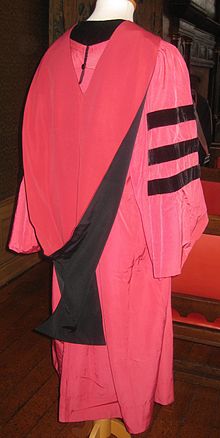 The Harvard doctoral gown and hood, which do not entirely follow the American Council on Education system Harvard University Doctoral Gown and Hood.jpg