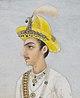 A king with a yellow crown with jewellery