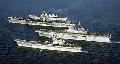 Four aircraft carriers, Principe-de-Asturias, USS Wasp, USS Forrestal  and HMS Invincible (front-to-back), showing the difference in size between a supercarrier, light V/STOL carriers, and an amphibious carrier.
