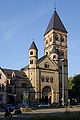 Paulusplatz 5: Katholische Pfarrkirche St. Paulus; stattliche neuromanische Querhausbasilika mit stadtbildprägendem Eckturm, 1905–07, Architekten Wilhelm Schmitz und Julius Wirtz