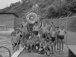 Pool in Osage in 1946 with swimmers and Rear Admiral Joel T. Boone
