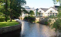 Rudbeck High School (Rudbecksgymnasiet) by the river Tidan