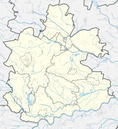 Mapa konturowa powiatu buskiego, w centrum znajduje się punkt z opisem „Skrobaczów”