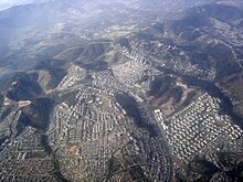 Cidade Tiradentes is a heavily populated area in the outskirts of Sao Paulo consisting mainly of public housing projects. On average, its inhabitants spend 2 hours and 45 minutes a day commuting between home and work. Cidade Tiradentes - Sao Paulo City.jpg