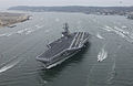 Sailors aboard Ronald Reagan man the rails as the supercarrier arrives at her new homeport in San Diego, California, on 23 July 2004.