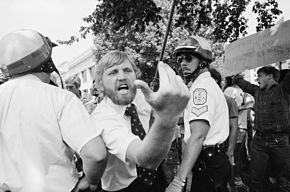 A heckler in Washington, D.C. leans across a police line toward a demonstration of Iranians during the Iran hostage crisis, August 1980. Heckler2.jpg