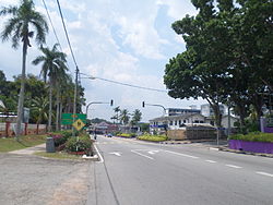 Traffic lights at a street in Jasin town, the former headquarters of the Municipal Council is on the right.