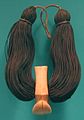 Lei niho palaoa (Hawaiian neck ornament), 19th century, carved sperm whale tooth, braided human hair, olonā cordage, Honolulu Museum of Art