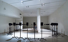Rows of speakers displayed in a gallery.