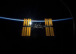 STS-119 International Space Station after undocking with earth atmosphere backdrop.jpg