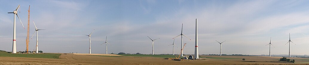 First wind farm consisting of 7.5 megawatt (MW) Enercon E-126 turbines, Estinnes, Belgium, 20 July 2010, two months before completion; note the 2-part blades.