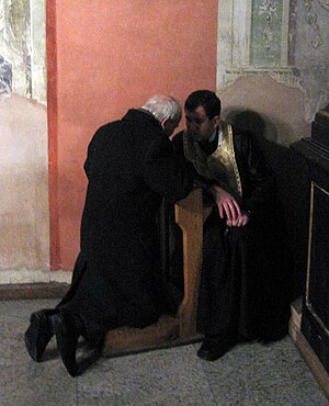 A penitent confessing his sins in the former L...