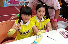 Frances & Aiko at an autograph event for "Follow Me" in 2013