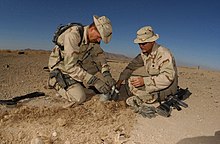 Two U.S. military servicemen wearing boonie hats in 2001 011223-N-2383B-506 EOD at work in Afghanistan.jpg