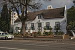 This building was erected between 1790 and 1800 and was the office of the Landdrost of Paarl. There is considerable difference of opinion on the early history of this building, due to the repeated sub division of properties.