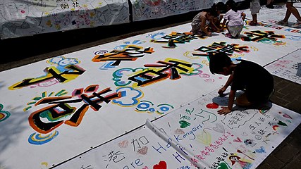 Kids drawing and writing their wishes and vision of the future of Hong Kong
