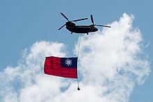 Republic of China Army CH-47 during the 2021 National Day celebration ceremony A ROCA CH-47 with a national flag of the Republic of China (Taiwan) at the National Day celebration ceremony 2021-10-10.jpg