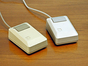 Apple Macintosh Plus mice (left) Beige mouse (...