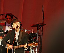 Gayol (left) performing with Leonard Cohen on 2012.