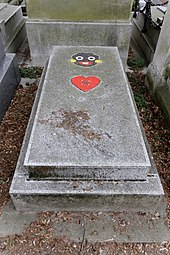 Patrick Kelly's grave with an image of a heart and a golliwog on it