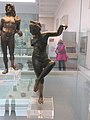 A small bronze sculpture of Venus loosening her sandal