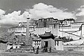 The Potala in 1936 with the village of Zhol at its base and the outer pillar outside the southern entrance.
