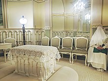 LDS woman in a sealing room wearing temple robes, including a veil. Salt Lake Temple Garb In Sealing Room.jpg