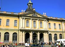 Image of the Swedish Stock Exchange building that houses the Swedish Academy, photographed during daytime.