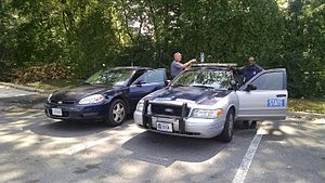 Two Virginia State Troopers in Fairfax County, Virginia with a Chevrolet Impala PPV (left) and Ford Crown Victoria Police Interceptor (right) Virginia State Police at Santini's Oakton.jpg
