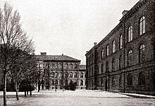 Photograph of two educational building surrounding a commons