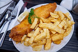 Fish and chips, a popular take-away food of the United Kingdom Fish and chips blackpool.jpg