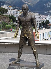 Statue of Ronaldo, in Madeira, resembles the pose he strikes before taking free kicks. Funchal CR7 Statue.JPG