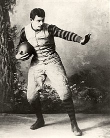 John Heisman, a University of Pennsylvania Law School class of 1892 alumnus and rugby football player, posing at Penn in 1891 holding elongated ellipsoidal rugby ball and gestures resembling the famed "Heisman Pose" HeismanPose.jpg