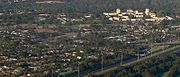 Aerial view over northern residential parts of Kew looking southwest showing Studley Park (top), Kew Asylum (right) and Eastern Freeway Earl Street exit (bottom right)