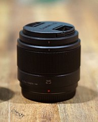 The Panasonic Lumix G 25mm F1.7 ASPH lens with its lens cap on