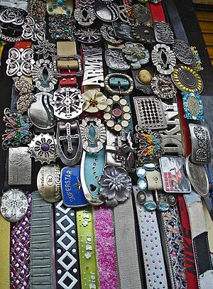 A shop selling a wide variety of belts with pl...