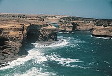 Port Campbell in southern Australia is a high-energy shoreline. Portcampbellcliffs.jpg
