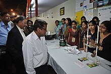 Students explain science projects to visitors. Susanna Hornig promotes the message that anyone can meaningfully engage with science, even without going as deeply into it as the researchers themselves do. Science & Technology Fair 2011 - Kolkata 2011-02-09 0921.JPG