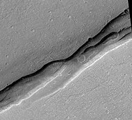 Sirenum Fossae, as seen by HiRISE.