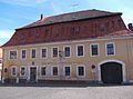 Gasthof „Goldener Stern“ in Ecklage, mit Seitenflügel, Mauer und Torbogen zur Hauptstraße