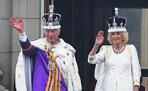 King and Queen on balcony waving