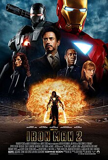 Tony Stark is pictured center wearing a smart suit, against a black background, behind him are is the Iron Man red and gold armor, and the Iron Man silver armor. His friends, Rhodes, Pepper, are beside him and below against a fireball appears Ivan Vanko armed with his energy whip weapons.